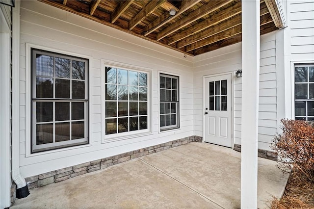 property entrance with a patio area
