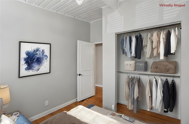 bedroom featuring light hardwood / wood-style floors and a closet