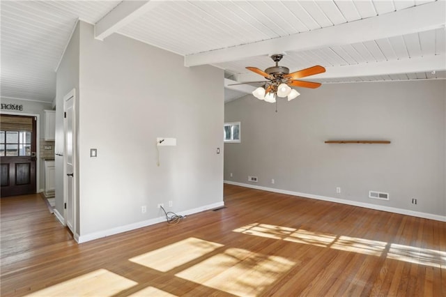 interior space with hardwood / wood-style flooring, ceiling fan, and vaulted ceiling with beams