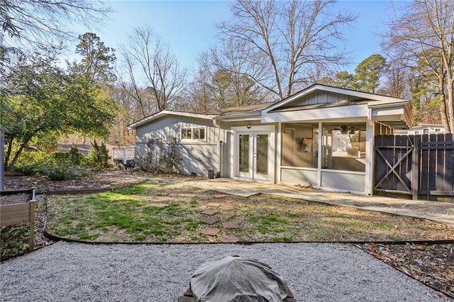 rear view of property featuring french doors