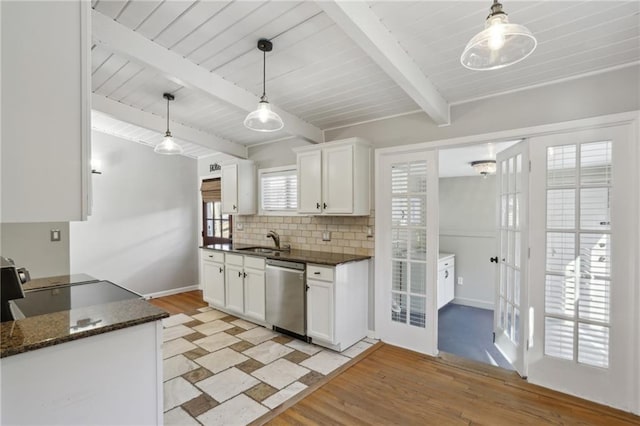 kitchen featuring white cabinetry, dishwasher, sink, and pendant lighting