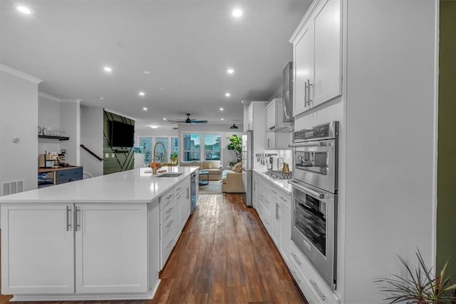 2066 Patterson Park Rd, Decatur, GA 30033 - kitchen with open floor plan, double oven, recessed lighting, a large island, and white cabinetry