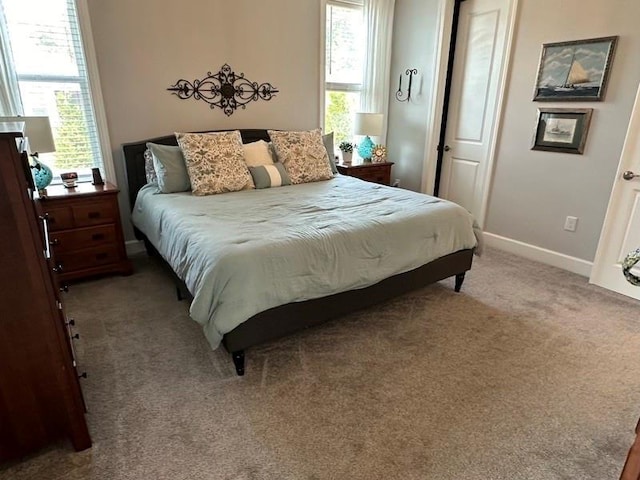 bedroom featuring light carpet