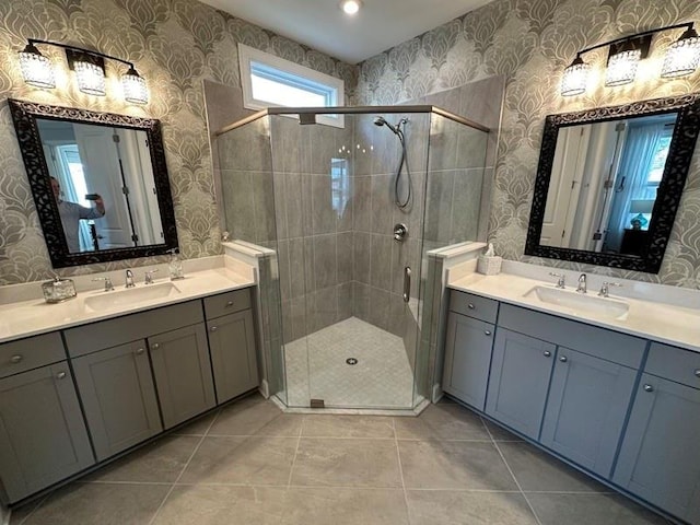 bathroom featuring tile patterned floors, vanity, and walk in shower