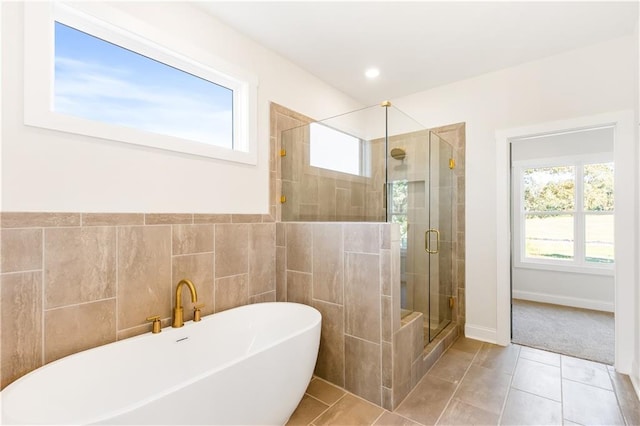 102 Red Oak Ln, Carrollton, GA 30116 - bathroom with a soaking tub, a stall shower, and tile patterned floors
