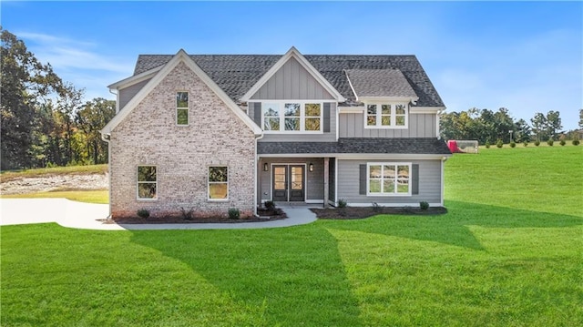 102 Red Oak Ln, Carrollton, GA 30116 - view of front of home featuring french doors, board and batten siding, and a front lawn
