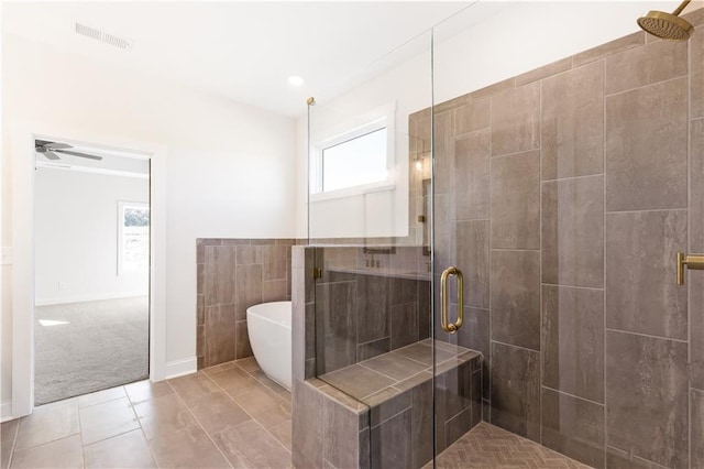 102 Red Oak Ln, Carrollton, GA 30116 - full bath with a stall shower, a freestanding tub, ceiling fan, and tile patterned flooring