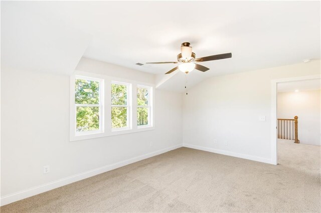 102 Red Oak Ln, Carrollton, GA 30116 - carpeted empty room featuring a ceiling fan and baseboards