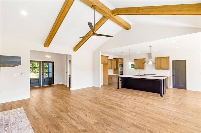 102 Red Oak Ln, Carrollton, GA 30116 - unfurnished living room featuring a ceiling fan, beamed ceiling, recessed lighting, light wood finished floors, and high vaulted ceiling