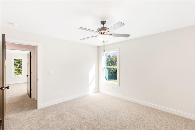 102 Red Oak Ln, Carrollton, GA 30116 - spare room featuring light colored carpet, ceiling fan, and a smoke detector