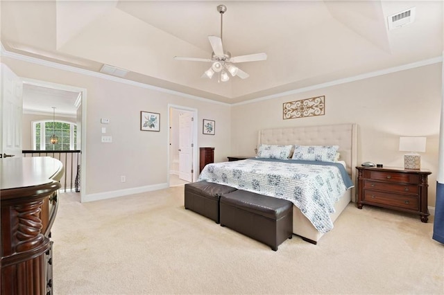 525 Roland Manor Dr, Dacula, GA 30019 - carpeted bedroom featuring a raised ceiling, baseboards, ornamental molding, connected bathroom, and ceiling fan