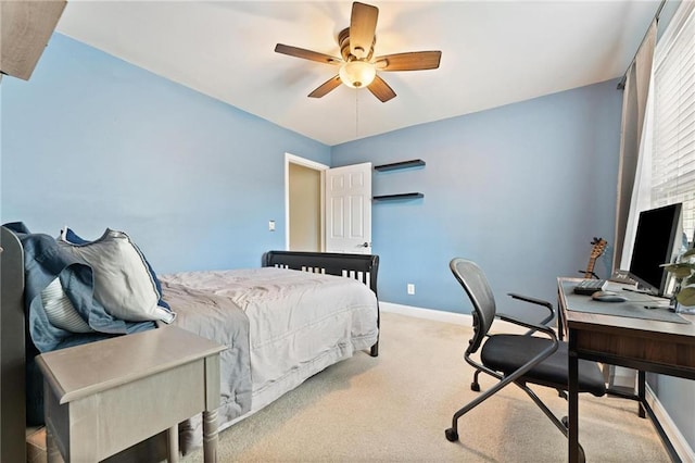 525 Roland Manor Dr, Dacula, GA 30019 - bedroom featuring light colored carpet, an office area, baseboards, and a ceiling fan