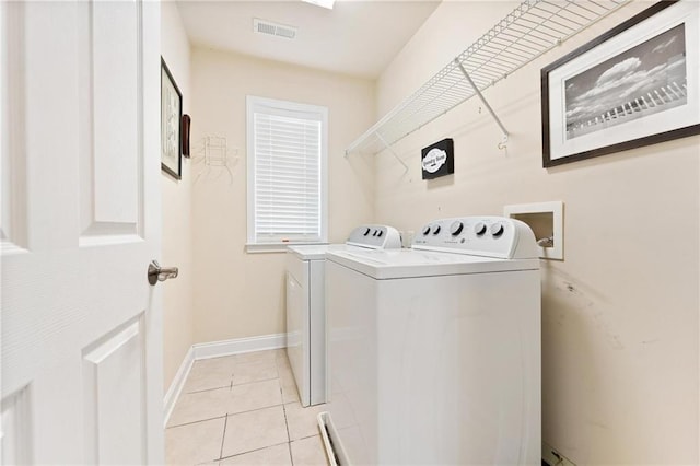 525 Roland Manor Dr, Dacula, GA 30019 - laundry room featuring washer and dryer, baseboards, and light tile patterned floors