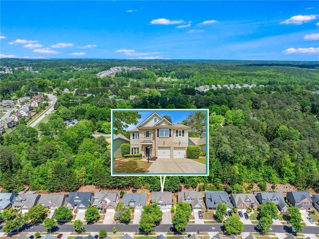 525 Roland Manor Dr, Dacula, GA 30019 - aerial view of residential area featuring property boundaries highlighted and a forest