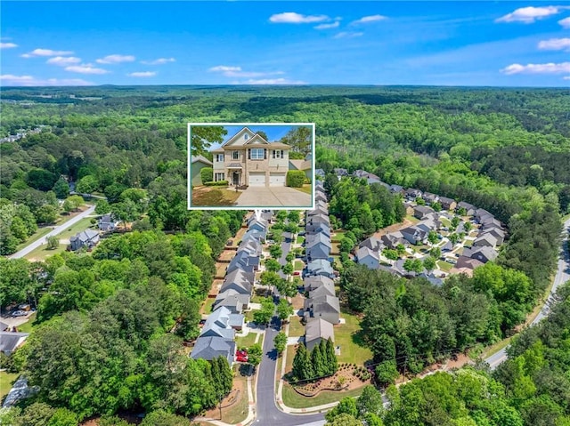 525 Roland Manor Dr, Dacula, GA 30019 - aerial perspective of suburban area with a forest and property boundaries highlighted