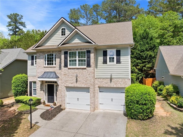 525 Roland Manor Dr, Dacula, GA 30019 - view of front of property with concrete driveway, a garage, brick siding, and a shingled roof