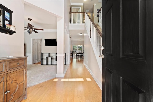 525 Roland Manor Dr, Dacula, GA 30019 - foyer entrance with ceiling fan, light wood-style flooring, stairway, ornamental molding, and baseboards