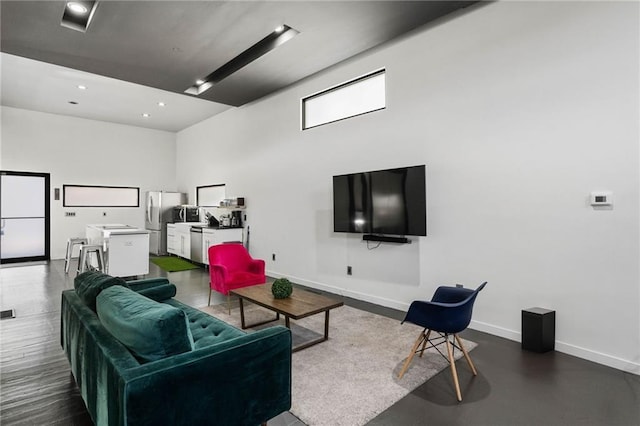 living room with a high ceiling