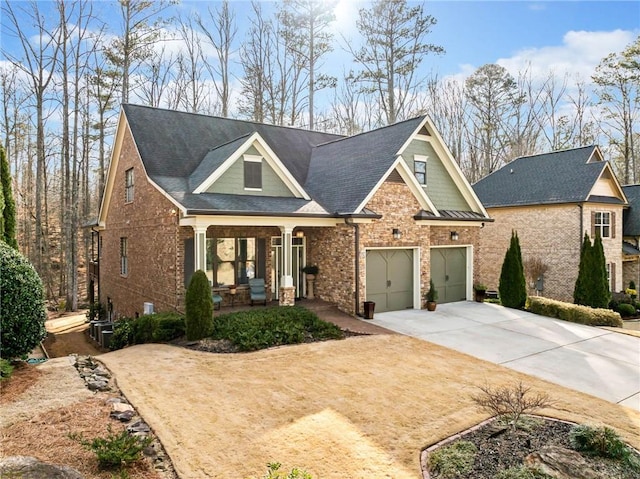 craftsman inspired home with a garage and a porch