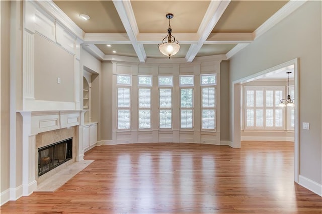 255 Beech Tree Holw, Sugar Hill, GA 30518 - unfurnished living room featuring a chandelier, light wood-style floors, a high end fireplace, beam ceiling, and built in features