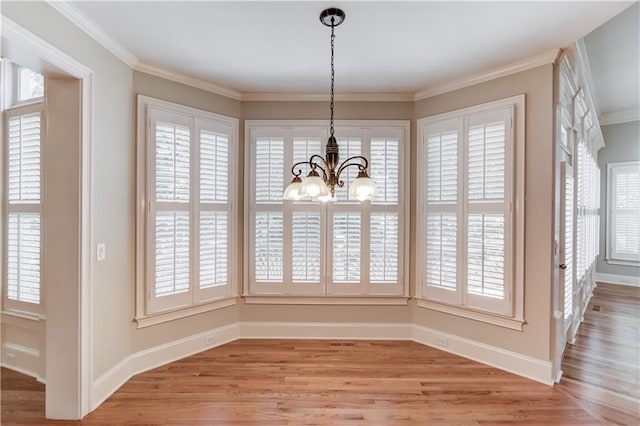 255 Beech Tree Holw, Sugar Hill, GA 30518 - unfurnished dining area with a chandelier, light wood-type flooring, plenty of natural light, baseboards, and ornamental molding