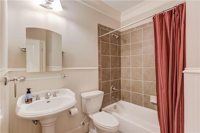 255 Beech Tree Holw, Sugar Hill, GA 30518 - bathroom featuring shower / bath combo with shower curtain, toilet, crown molding, a wainscoted wall, and a sink