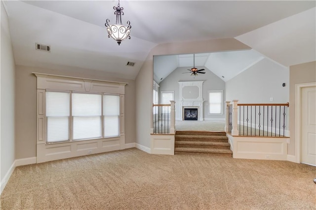 255 Beech Tree Holw, Sugar Hill, GA 30518 - unfurnished living room with carpet, ceiling fan, vaulted ceiling, and stairway