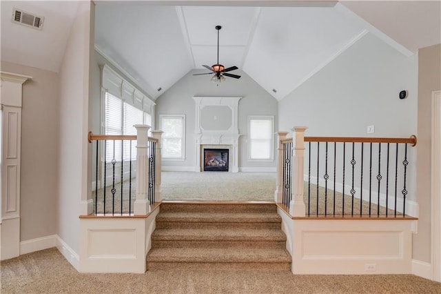 255 Beech Tree Holw, Sugar Hill, GA 30518 - stairway featuring carpet flooring, a ceiling fan, healthy amount of natural light, vaulted ceiling, and a glass covered fireplace
