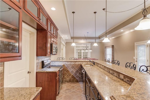 255 Beech Tree Holw, Sugar Hill, GA 30518 - kitchen featuring appliances with stainless steel finishes, crown molding, a kitchen bar, pendant lighting, and light stone countertops