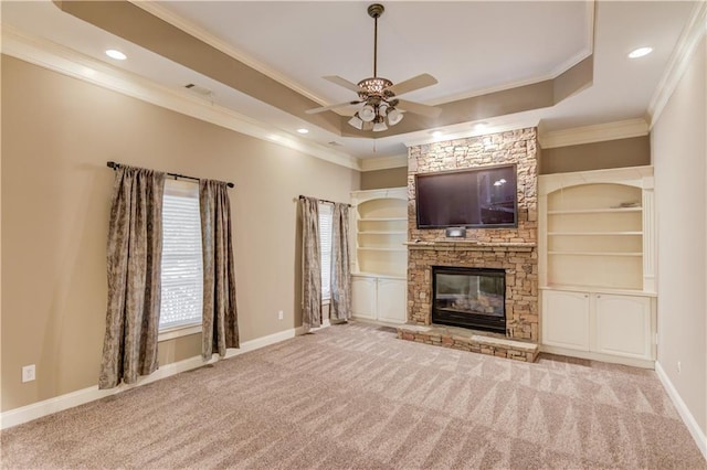 255 Beech Tree Holw, Sugar Hill, GA 30518 - unfurnished living room featuring a raised ceiling, ceiling fan, crown molding, carpet flooring, and baseboards