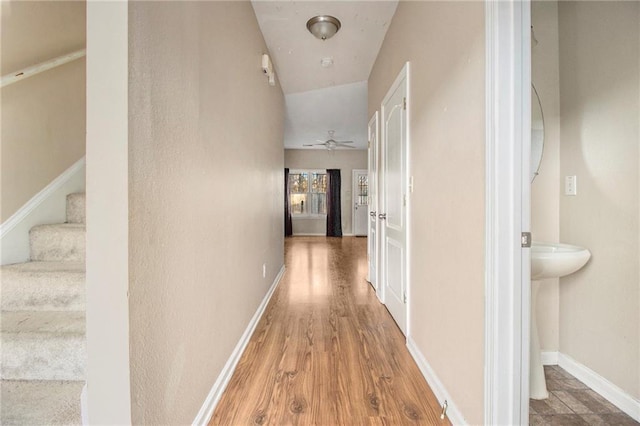 hallway featuring wood-type flooring