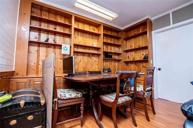 interior space with ornamental molding and light wood-type flooring