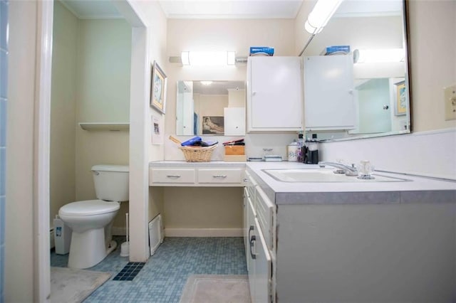 bathroom featuring vanity, crown molding, and toilet