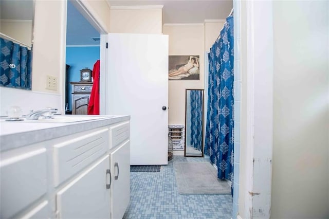 bathroom featuring vanity and ornamental molding