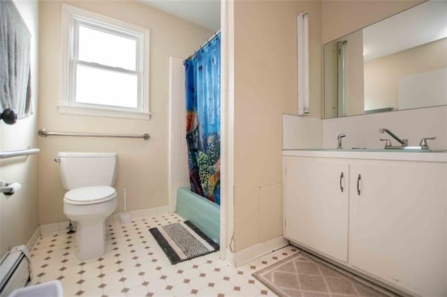 full bathroom with vanity, toilet, shower / bath combo, and baseboard heating