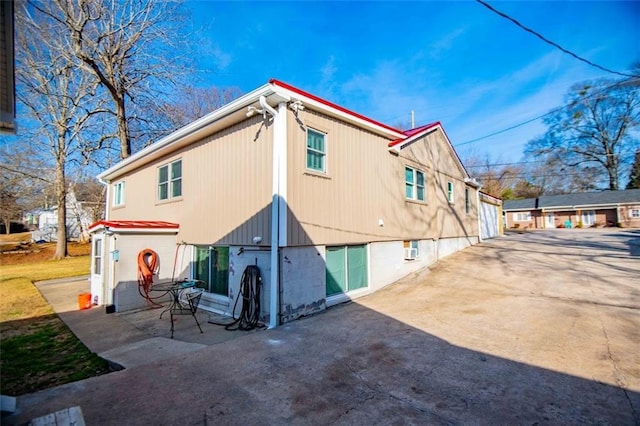 back of property featuring a patio area