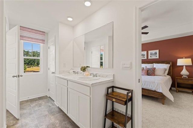 bathroom featuring ceiling fan and vanity