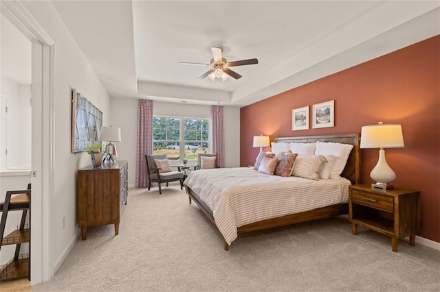 bedroom featuring ceiling fan and light carpet