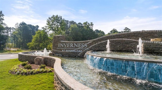 view of swimming pool featuring pool water feature