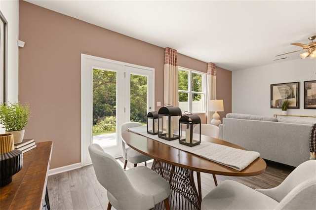 dining space featuring ceiling fan and hardwood / wood-style flooring