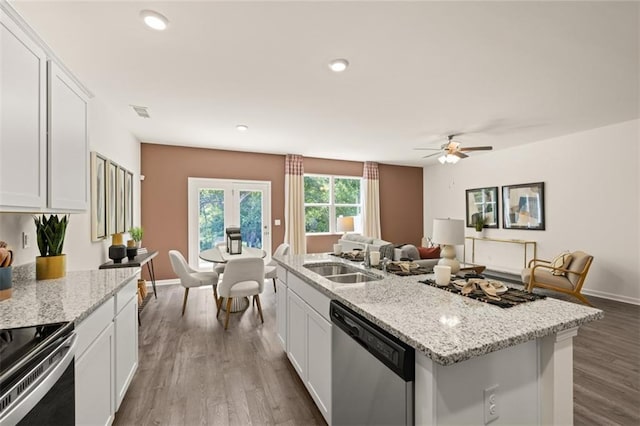 kitchen with ceiling fan, stainless steel appliances, white cabinetry, and sink