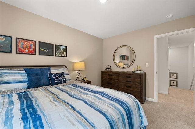 bedroom featuring light carpet