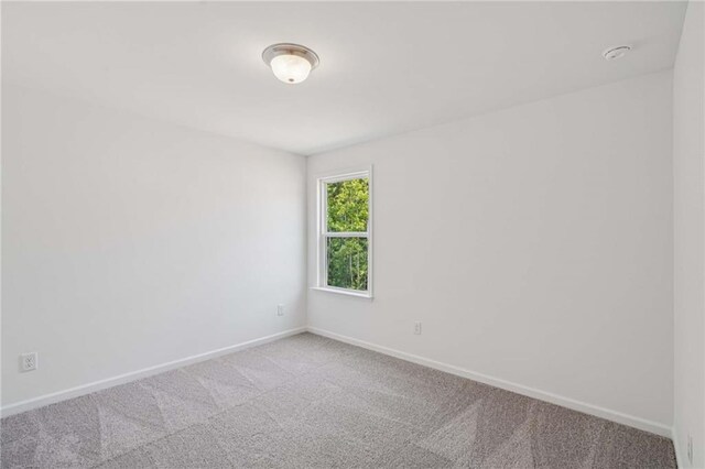 7252 Eton Ln, Locust Grove, GA 30248 - empty room with carpet and a smoke detector