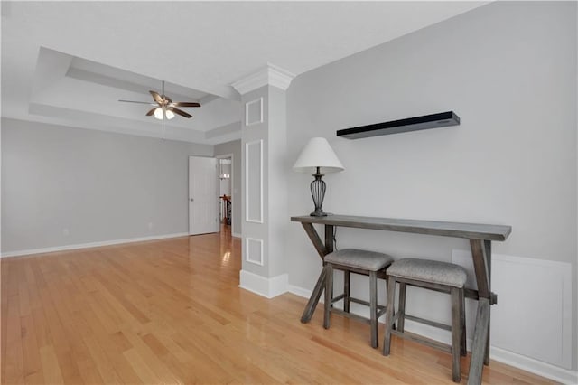 207 Amaranth Ct, Ball Ground, GA 30107 - sitting room featuring a tray ceiling, ceiling fan, and wood finished floors