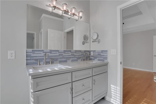 207 Amaranth Ct, Ball Ground, GA 30107 - bathroom with tasteful backsplash, double vanity, and wood finished floors