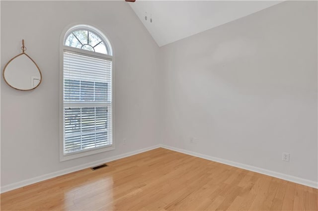 207 Amaranth Ct, Ball Ground, GA 30107 - unfurnished room with wood finished floors and vaulted ceiling