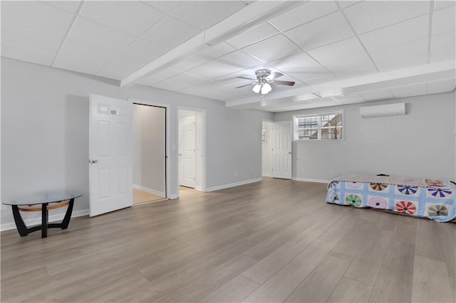 207 Amaranth Ct, Ball Ground, GA 30107 - spare room with ceiling fan, a wall mounted air conditioner, light wood-type flooring, and a drop ceiling