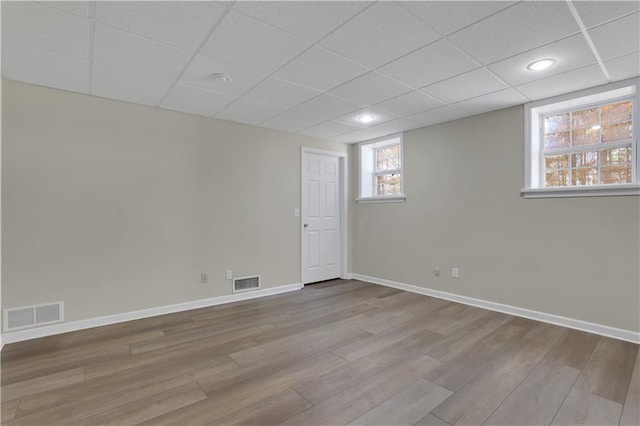 207 Amaranth Ct, Ball Ground, GA 30107 - below grade area featuring wood finished floors, a drop ceiling, and recessed lighting