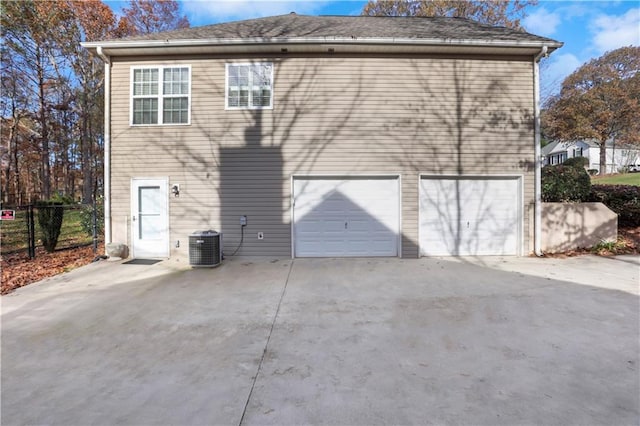 207 Amaranth Ct, Ball Ground, GA 30107 - rear view of property featuring driveway and an attached garage