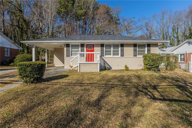 view of front of house featuring a front yard, crawl space, brick siding, and an attached carport